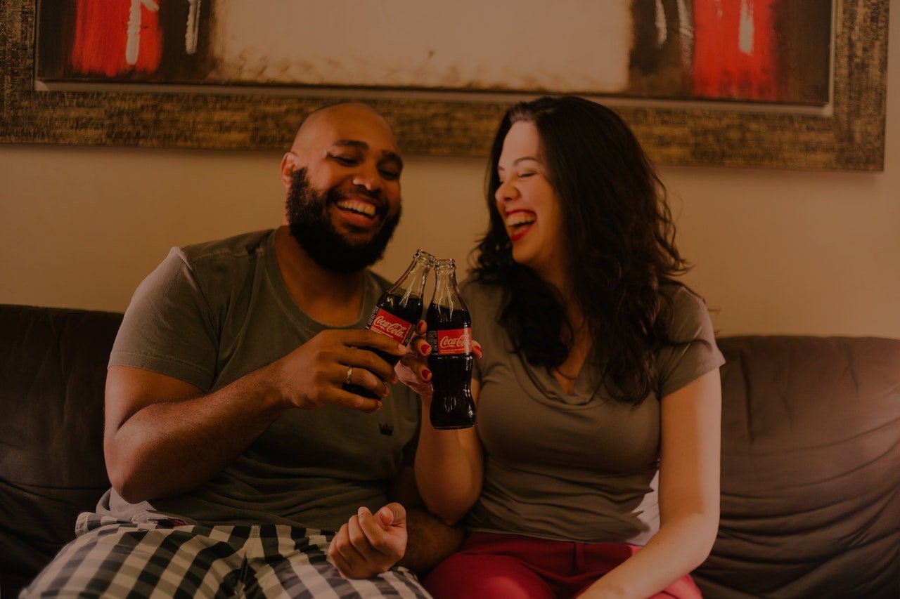 People happily drinking coca-cola