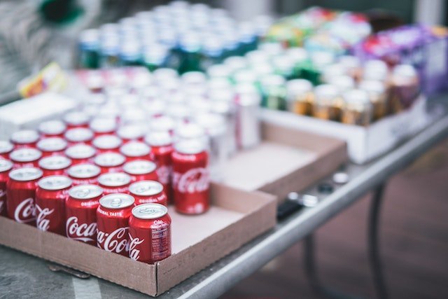 Image showing Coca Cola cans in a crate
