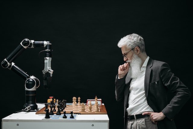 Image showing an old man thinking of how to solve a problem