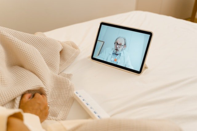 A patient using telehealth